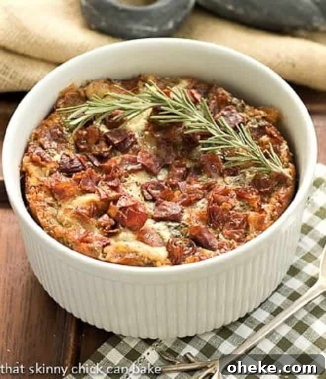 Prosciutto, Gorgonzola and Rosemary Strata - a man approved breakfast entree Prosciutto, Gorgonzola and Rosemary Strata in a round casserole dish with a sprig of rosemary to garnish
