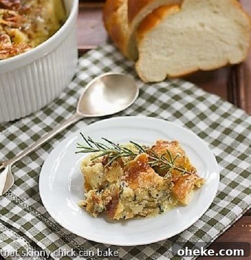 Prosciutto, Gorgonzola & Rosemary Breakfast Strata Recipe 2 Breakfast strata on a white plate with a sprig of rosemary