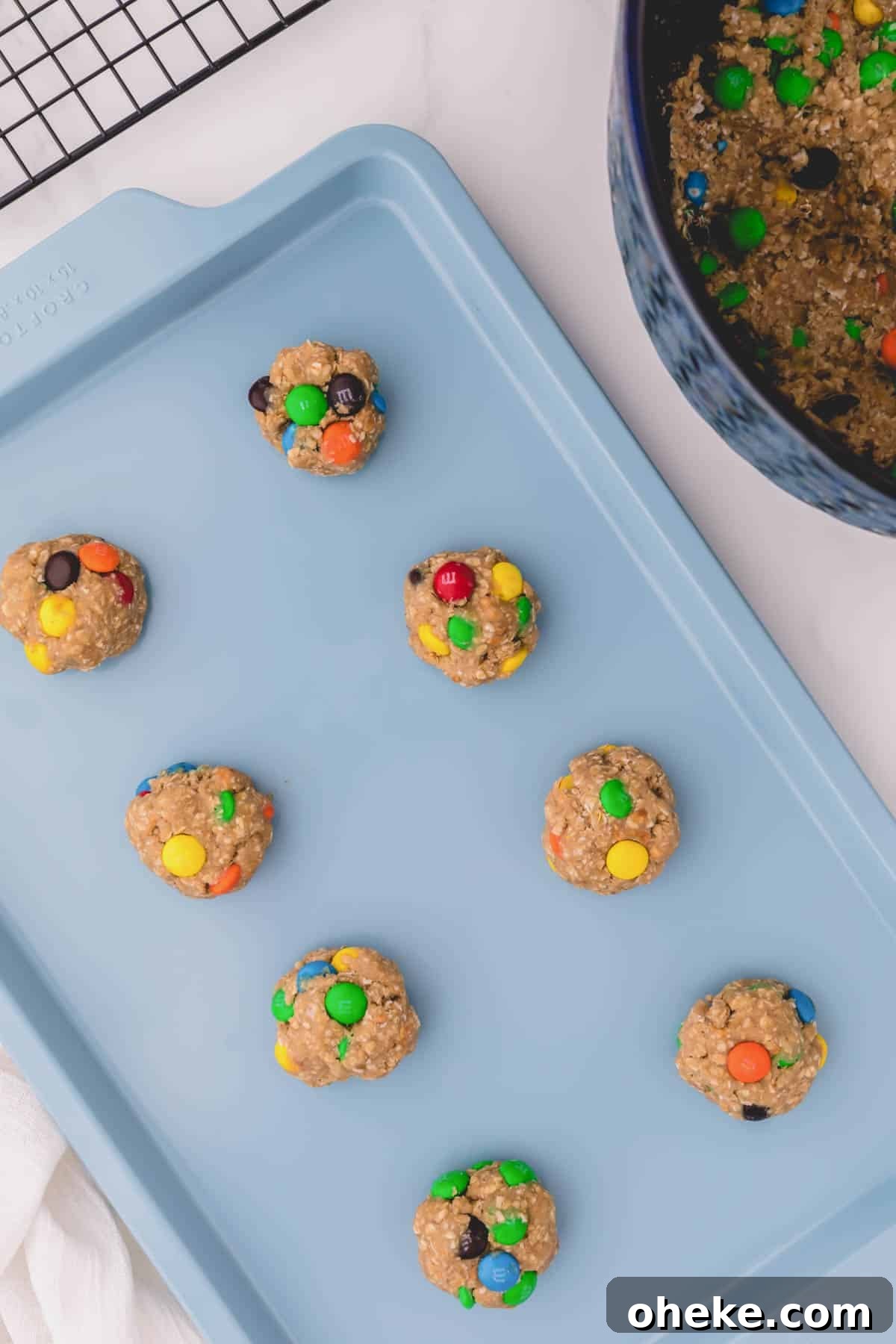 Apple Cinnamon Instant Oatmeal Cookies Recipe — Quick Baked Treat 5 oatmeal cookie dough balls on a sheet pan