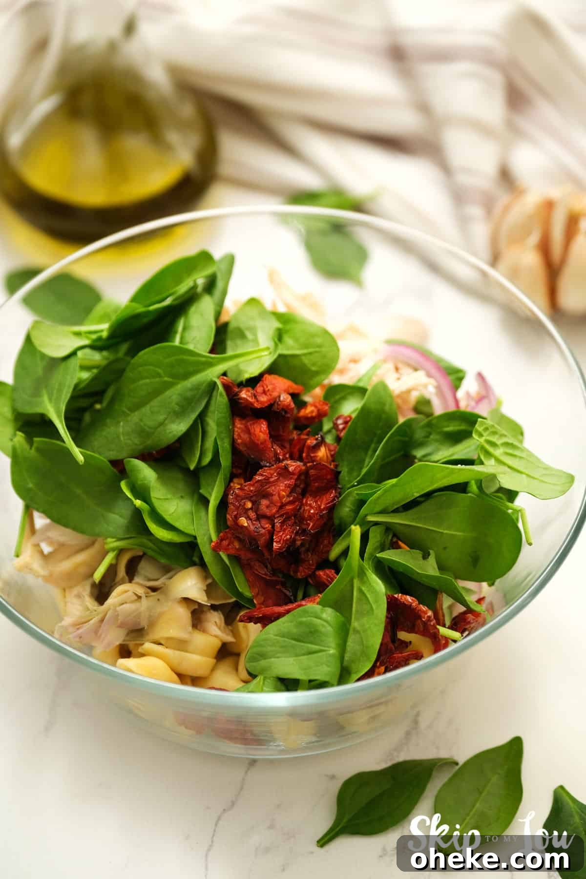 how to make tortellini salad add salad ingredients to a bowl