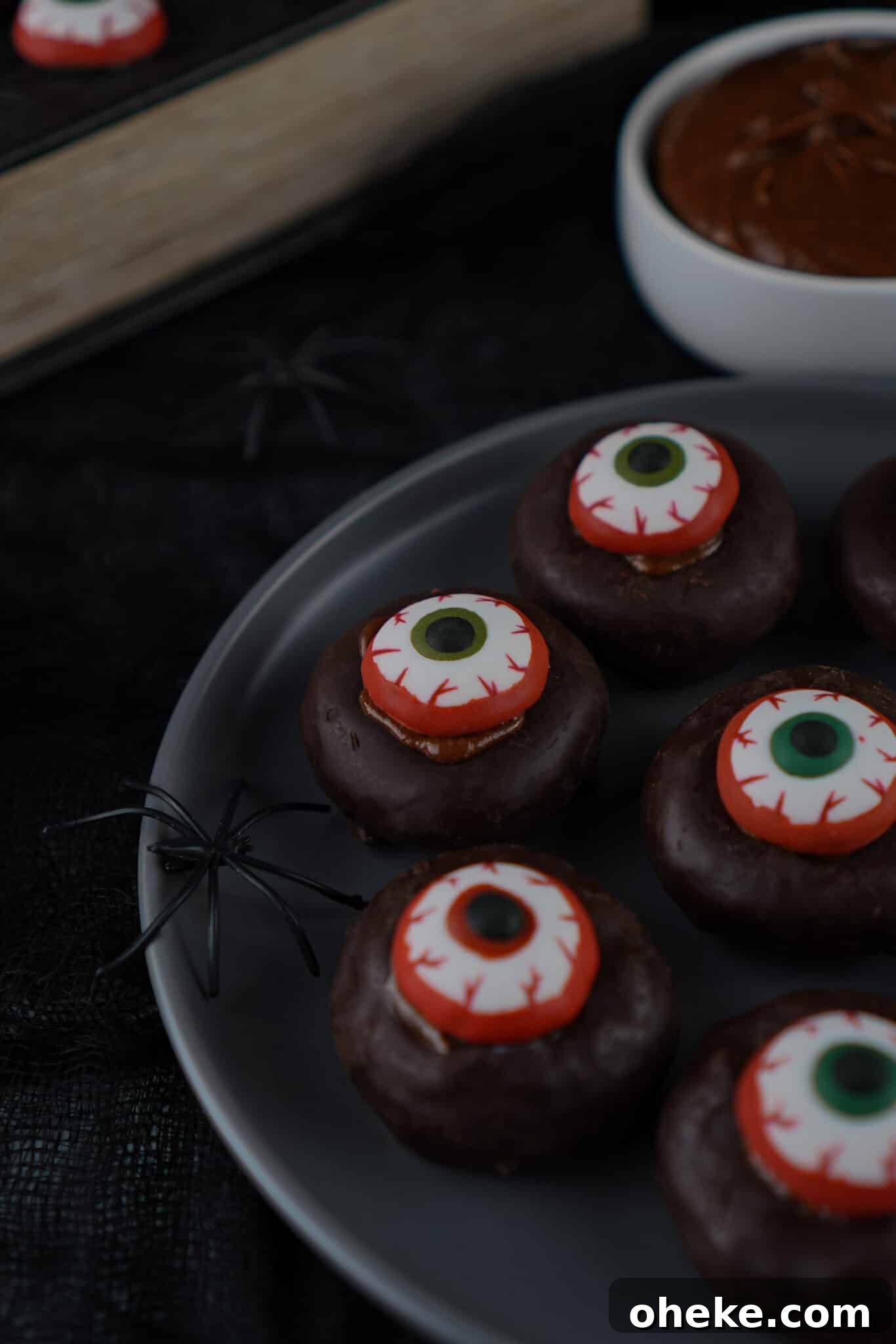 side view of mini eyeball donuts on plate