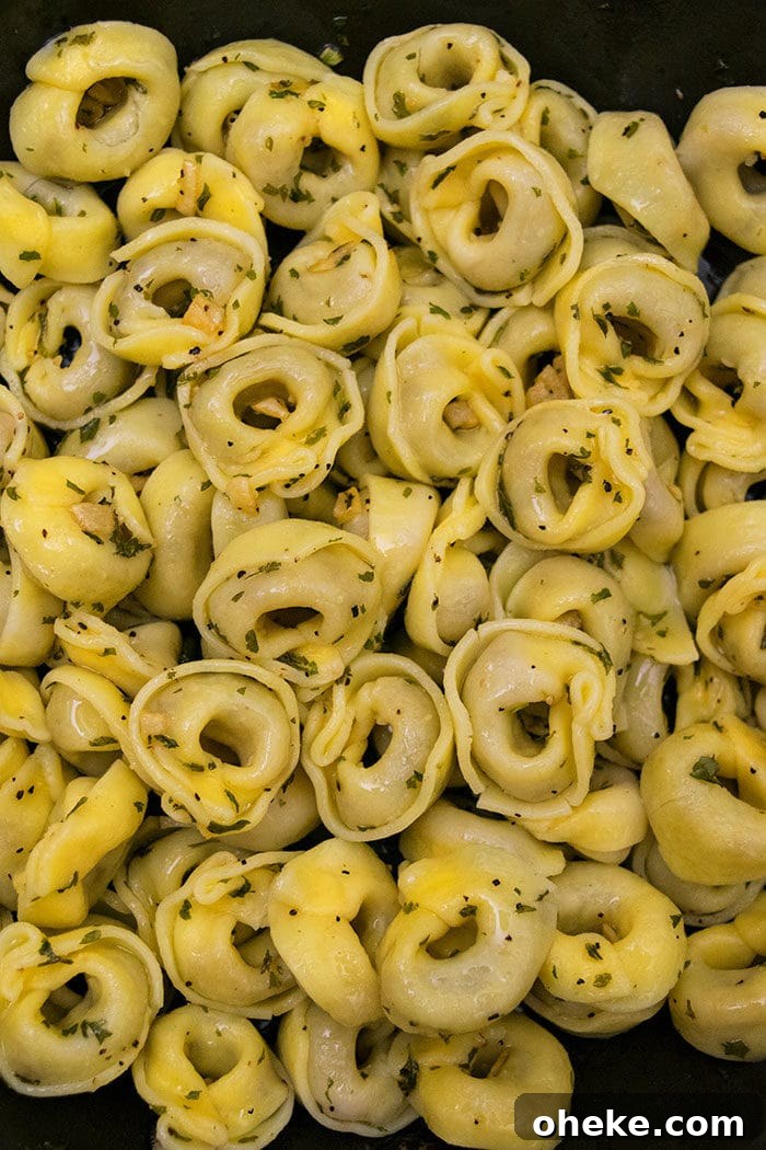 Closeup Shot of Garlic Tortellini in Black Pot.