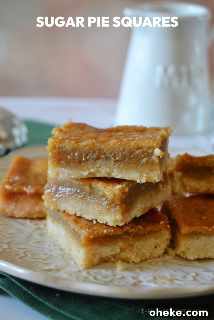 a trio stack of sugar pie squares on a white plate on top of a green dish cloth with a milk jug in the background