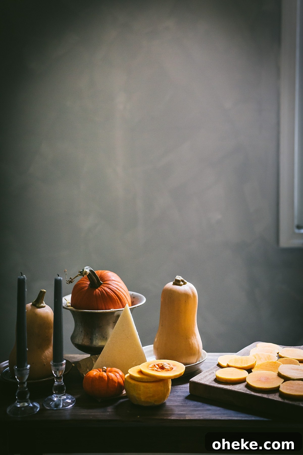 still life of squash, pumpkin, and candles