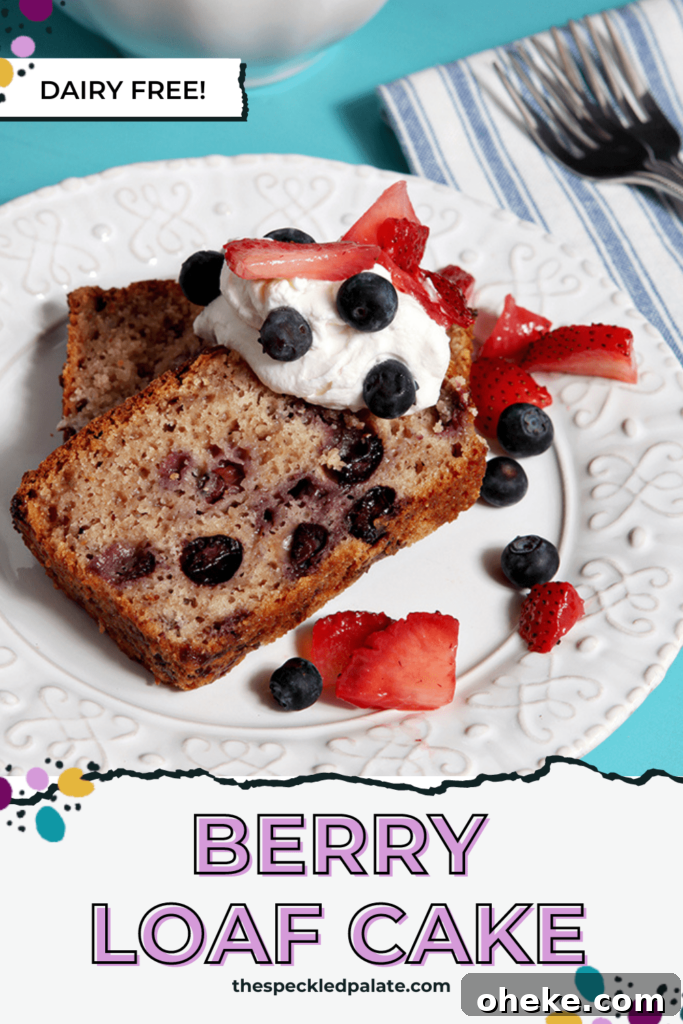 Two slices of blueberry cake on a plate with whipped cream, blueberries and strawberry slivers with the text Berry Loaf Cake