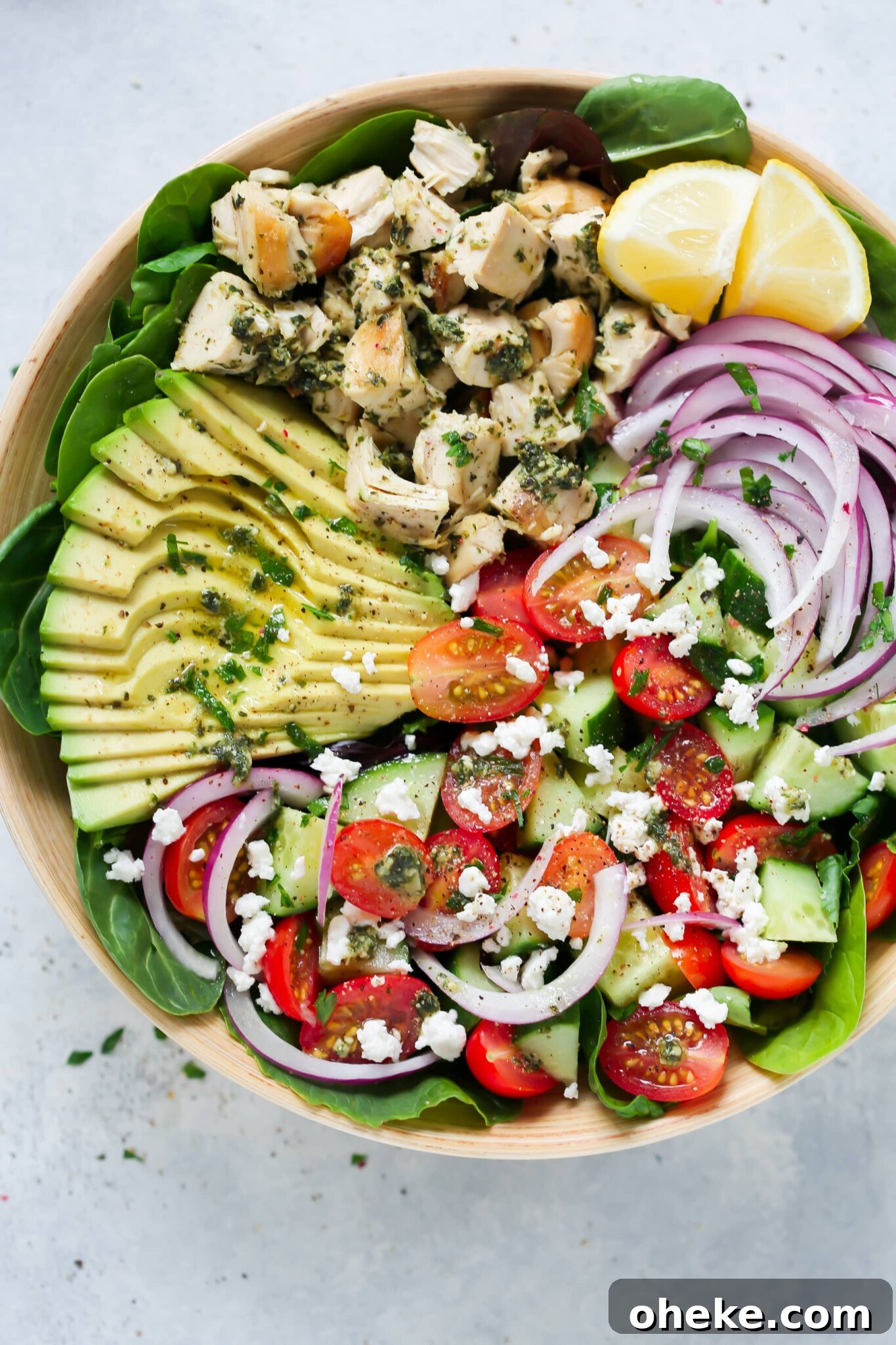 Pesto chicken salad in a large serving bowl.