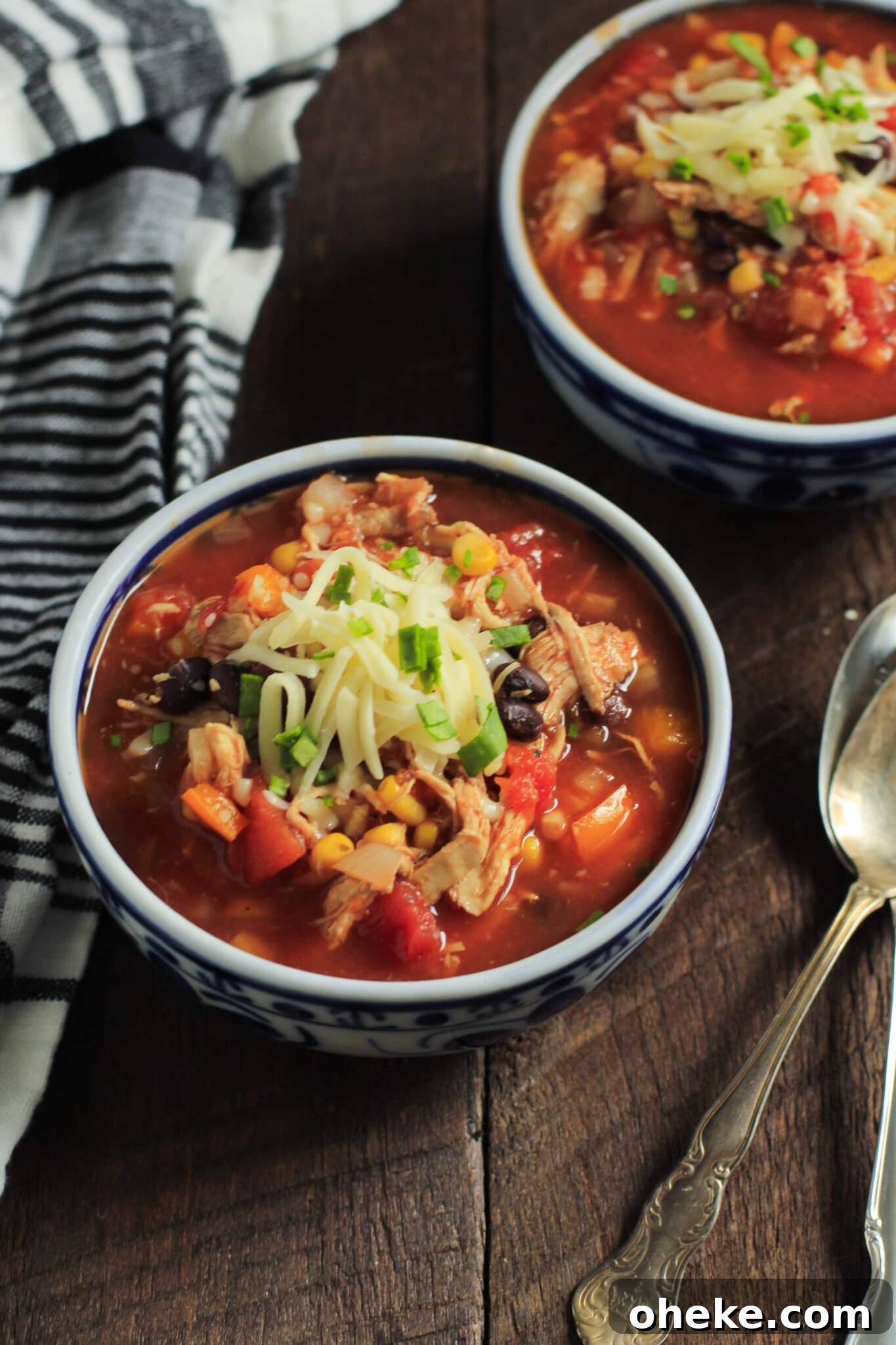 Slow cooker chicken chili in serving bowls. 