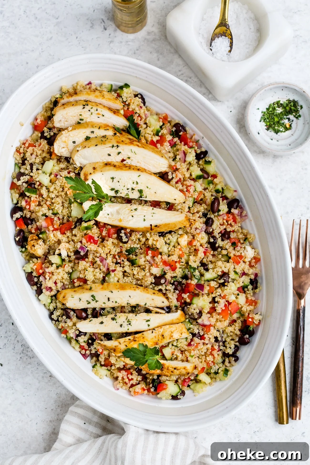 Chicken quinoa salad in a large, white serving dish.