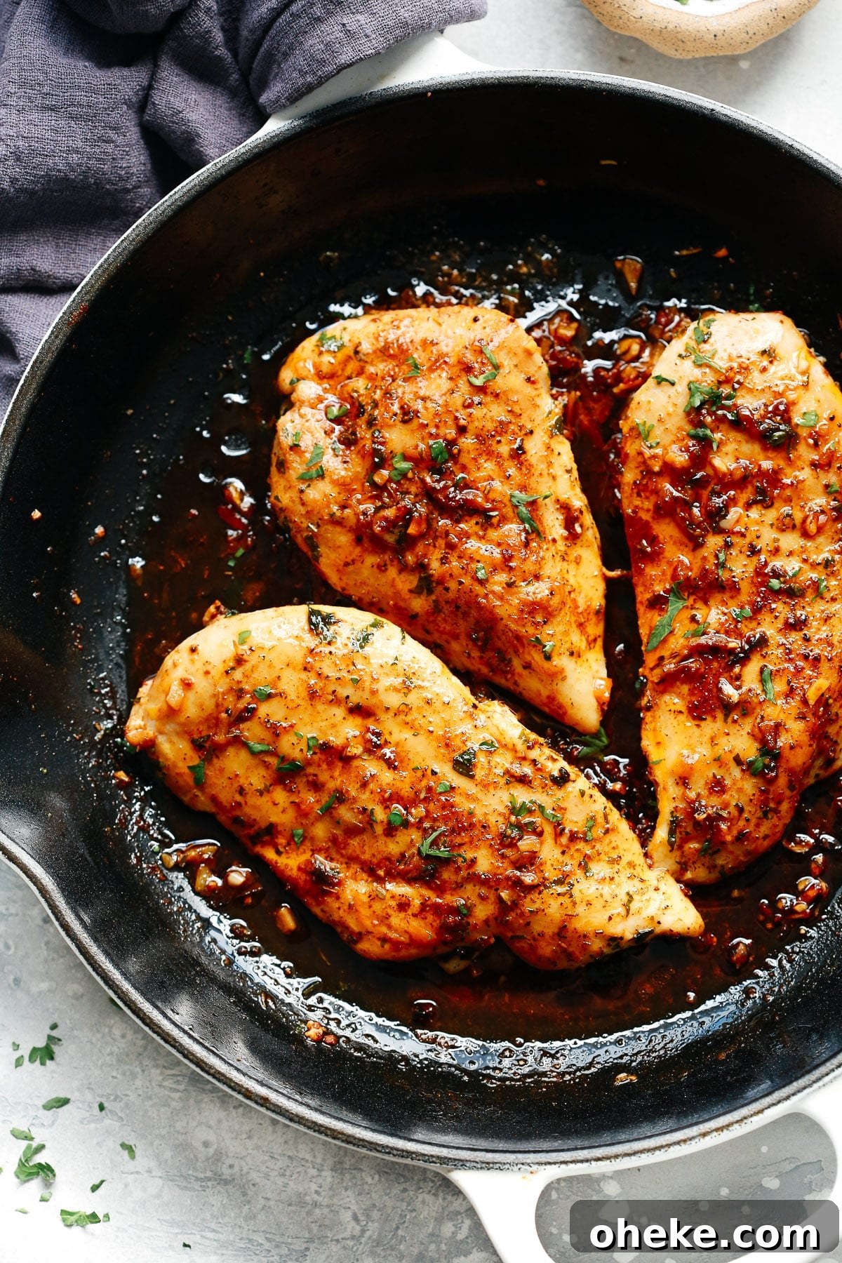 A skillet filled with garlic butter chicken breast