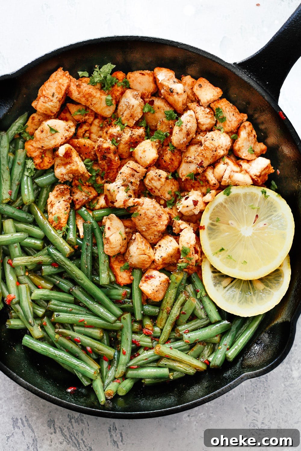 Spicy Green Beans Chicken in a cast iron Skillet.