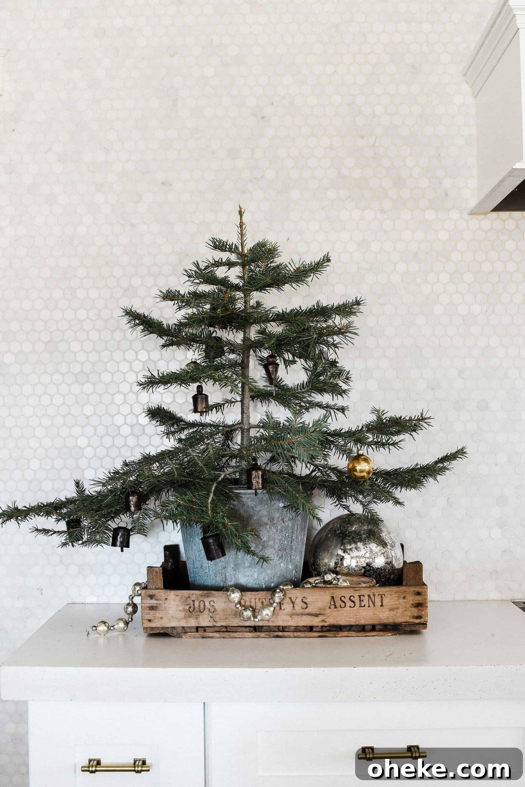 Tour our Christmas kitchen to gather ideas for decorating for the holidays this year! Use greenery and vintage touches to keep things simple and cohesive!