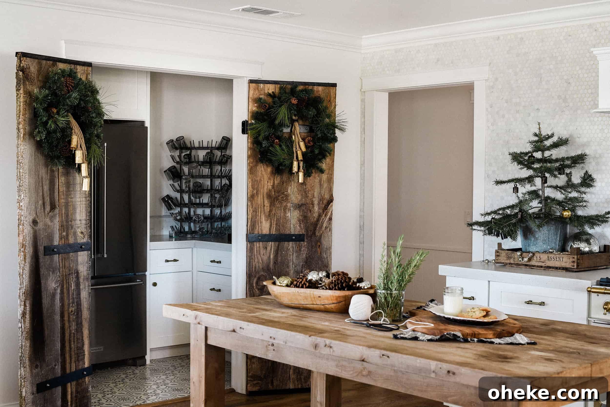 Tour our Christmas kitchen to gather ideas for decorating for the holidays this year! Use greenery and vintage touches to keep things simple and cohesive!