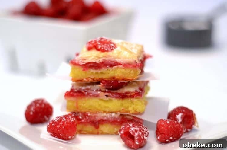 A close up of a stack of Raspberry Brownie Baklava squares.