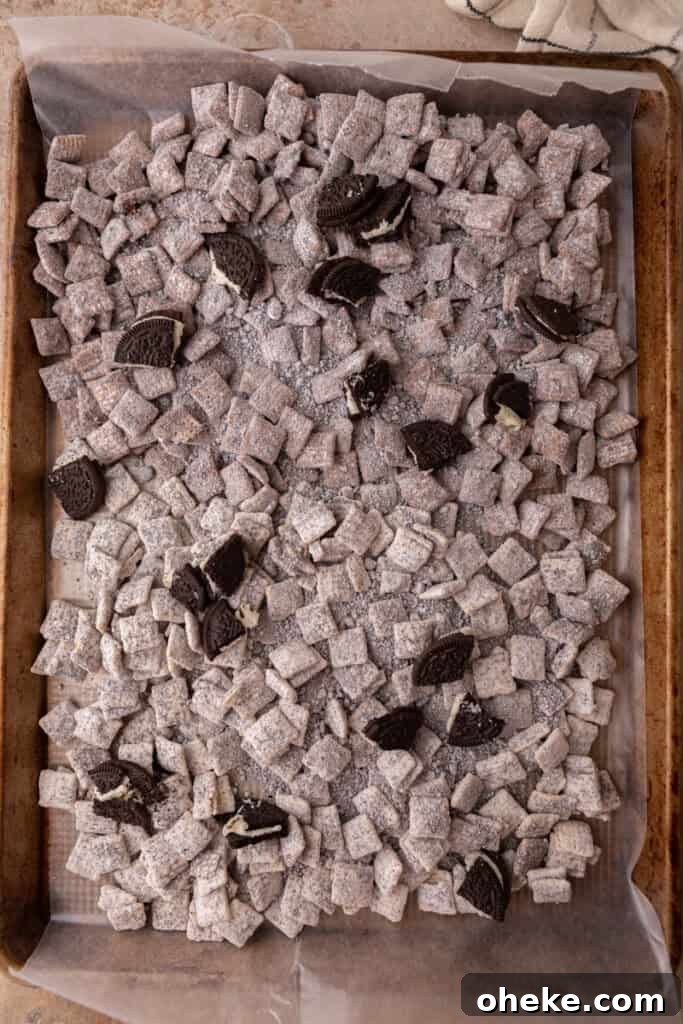fully mixed cookies, chocolate and chex on a sheet pan